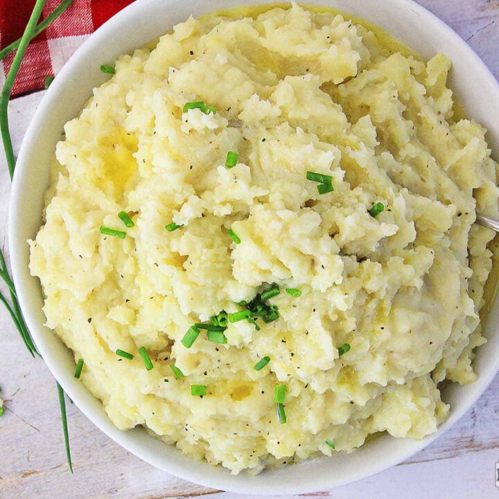Mashed potatoes in a white bowl.